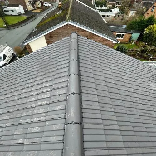 Finished grey tiled roof with dry ridge system