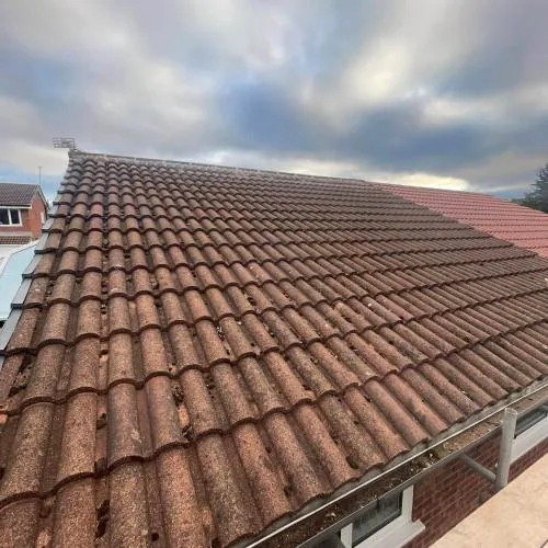 Re-roof with brown interlocking concrete tiles